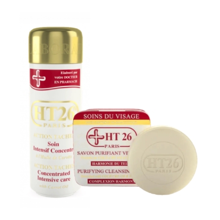 Image des produits de soin HT26 Paris. Comprend une lotion de soin concentrée à l'huile de carotte en flacon et un savon nettoyant purifiant de forme circulaire. Les deux articles sont étiquetés en rouge et blanc. Dakar
