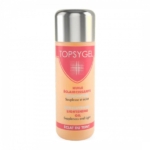 Un flacon rose et beige d'huile cosmétique éclaircissante Topsygel. L'étiquette présente un texte en français et en anglais, soulignant son action éclaircissante, souple et lumineuse. Le bouchon est argenté métallisé. Dakar