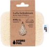 Un coussin de savon en luffa avec une étiquette en carton. L'étiquette indique en allemand que le produit est fabriqué à partir de luffa et de coton 100 % compostables. Le logo HYDROPHIL est visible sur l'étiquette et sur le coussin. Dakar