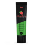 Tube de lubrifiant Intt Fraise avec bouchon et embout noirs. Le tube est principalement vert avec une partie noire en haut, ornée d'un motif fraise. Le texte indique qu'il s'agit d'un lubrifiant à base d'eau au goût fraise, 100 ml. Dakar