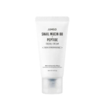 Tube blanc de crème visage Jumiso à la mucine d'escargot 88 + peptides. L'étiquette précise qu'elle est non comédogène, contient 30 ml de produit et contient 88 % de filtrat de bave d'escargot. Dakar