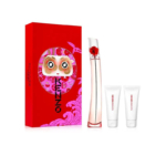 Un coffret cadeau vibrant comprenant un flacon de parfum haut et fin avec un design coquelicot, deux petits tubes et une boîte rouge audacieuse avec des graphismes artistiques, notamment des yeux et des motifs tourbillonnants. Dakar