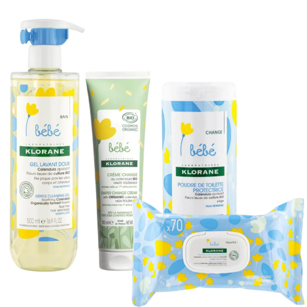 L'image présente un coffret de soins Klorane pour bébé, comprenant un savon gel de 500 ml, un tube de crème, un flacon de poudre protectrice et un paquet de 70 lingettes. L'emballage est orné de motifs floraux bleus et jaunes. Dakar