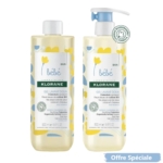 Deux flacons de gel lavant doux Klorane pour bébé sont présentés, chacun de 500 ml. L'un est équipé d'une pompe, l'autre d'un bouchon à vis. Les étiquettes arborent des fleurs jaunes et la mention « Offre Spéciale » en bas à droite. Dakar