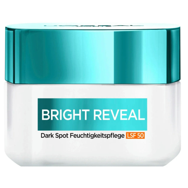 Un petit récipient blanc avec un couvercle bleu sarcelle étiqueté « BRIGHT REVEAL » avec « Dark Spot Feuchtigkeitspflege LSF 50 » indiquant un produit de soin de la peau. Dakar