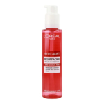 Un flacon rouge de sérum nettoyant resurfaçant Revitalift de L'Oréal Paris, avec une pompe blanche. Contient 3,5 % d'acide glycolique et est conçu pour nettoyer, exfolier, renouveler la surface de la peau et la raffermir. Convient aux peaux sensibles et testé dermatologiquement. Dakar
