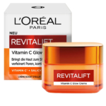 Voici l'emballage de la crème éclat à la vitamine C Revitalift de L'Oréal Paris. La boîte est blanche avec un texte rouge et noir, et le contenant est orange avec un couvercle transparent. Le texte met en avant les bienfaits de la vitamine C et de l'acide salicylique. Dakar