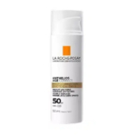 Un flacon blanc de crème solaire La Roche-Posay Anthelios Age Correct. Il arbore un logo carré orange et un texte précisant l'indice SPF 50, la correction des rides et des taches brunes. Le flacon de 50 ml est étiqueté « Fabriqué en France ». Dakar