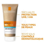 Tube de crème solaire Anthelios de La Roche-Posay, étiqueté SPF 50+ avec une haute protection UVB/UVA. Convient à tous les types de peau et testé sous contrôle dermatologique. L'image comprend un texte en français mettant en évidence ces caractéristiques. Dakar
