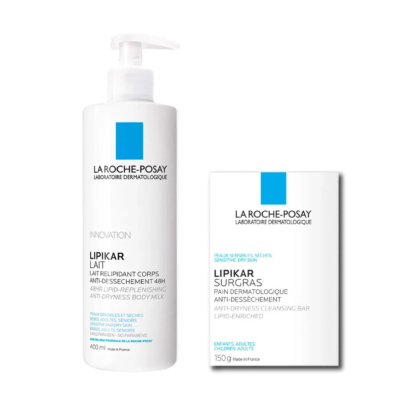 Un flacon pompe blanc et une boîte, tous deux étiquetés « La Roche-Posay Lipikar ». Le flacon contient le Lait Corps Relipidant (400 ml) et la boîte le Pain Nettoyant Surgras Lipikar (150 g). Tous deux arborent une étiquette bleue et mettent l'accent sur l'action anti-dessèchement. Dakar