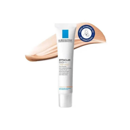 Un tube de crème teintée La Roche-Posay Effaclar Duo+ Unifiant Anti-Imperfections est présenté avec le produit étalé à l'arrière. Un badge bleu indiquant les tests dermatologiques est visible à côté du tube. Dakar