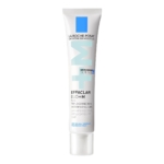 Un tube blanc de La Roche-Posay Effaclar Duo+ M, présenté comme un soin solaire triple correction anti-imperfections. Le tube arbore un logo bleu et blanc, ainsi qu'un texte détaillant ses propriétés correctrices. Dakar