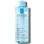 Un flacon d'Eau Micellaire Ultra de La Roche-Posay pour peaux réactives. Son flacon bleu translucide est orné d'une étiquette blanche et bleue, soulignant son utilisation pour le nettoyage et le démaquillage. Contenance : 400 ml. Dakar