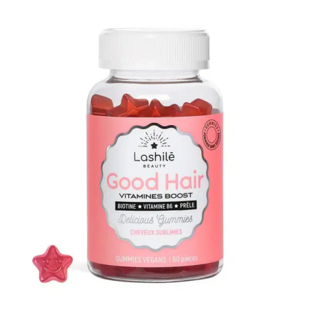 Une bouteille en plastique étiquetée « Lashilé Beauty Good Hair » contient 60 bonbons gélifiés rouges en forme d'étoile. L'étiquette présente des ingrédients comme la biotine et la vitamine B6, et mentionne leur caractère végétalien. Un bonbon gélifié est placé à l'extérieur de la bouteille. Dakar
