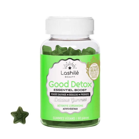 Une bouteille en plastique transparent avec un bouchon blanc étiqueté « Lashilé Beauty Good Detox » en vert et blanc. Elle contient des compléments gélifiés en forme d'étoiles vertes. La bouteille est étiquetée vegan et contient 60 gélifiés. Un seul gélifié est placé à côté de la bouteille. Dakar