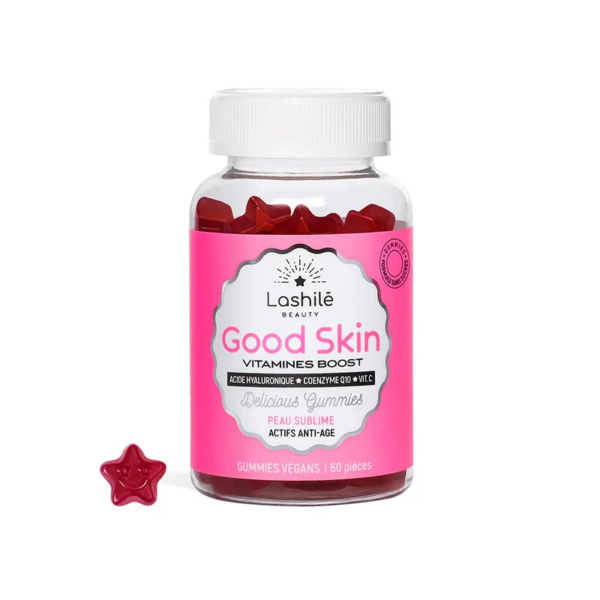 Un pot de bonbons vitaminés « Bonne Peau » de Lashilé Beauty. Le contenant transparent, orné d'une étiquette rose, présente des bonbons rouges en forme d'étoile, soulignant leurs propriétés bénéfiques pour la peau. Un bonbon est placé à l'extérieur du pot. Contient 60 bonbons. Dakar