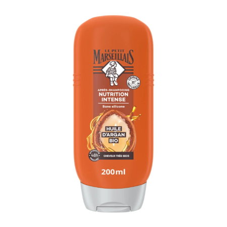 Flacon orange de 200 ml d'après-shampoing Le Petit Marseillais à l'huile d'argan pour une nutrition intense, sans silicone. Conçu pour les cheveux très secs, il est enrichi d'une touche d'huile d'argan sur l'étiquette. Dakar