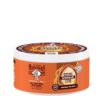Un pot rond et orange contenant le masque capillaire Le Petit Marseillais, étiqueté « Nutrition Intense » et « Huile d'Argan Bio » pour cheveux très secs. Le produit est revendiqué comme biodégradable à 98 % et sans silicone. Dakar