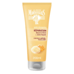 Tube jaune d'après-shampoing Le Petit Marseillais au beurre d'olive et à la gelée royale, conçu pour les cheveux abîmés et fragiles. L'étiquette est en français. Le tube contient 200 ml. Dakar
