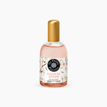 Un flacon d'eau de toilette « Les Petits Plaisirs », étiqueté « Fleur de Coton ». Le flacon est doté d'un bouchon doré et l'emballage présente un motif de fleurs de coton. Dakar