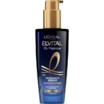 Un flacon de sérum de nuit Elvital Öl Magique de L'Oréal Paris, orné d'un design bleu foncé aux touches dorées. Le texte souligne qu'il contient de l'huile de camélia et qu'il s'agit d'un soin sans rinçage pour cheveux secs, à utiliser toute la nuit. Dakar