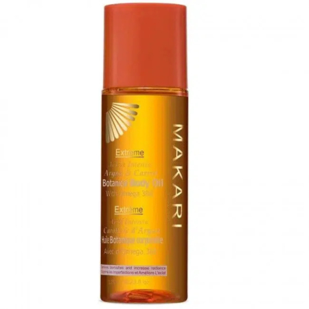 Un flacon d'huile corporelle botanique extrême Makari aux huiles d'argan et de carotte, avec un bouchon et une étiquette orange. Ce produit est formulé pour une hydratation intense et un éclat sublimé. Dakar