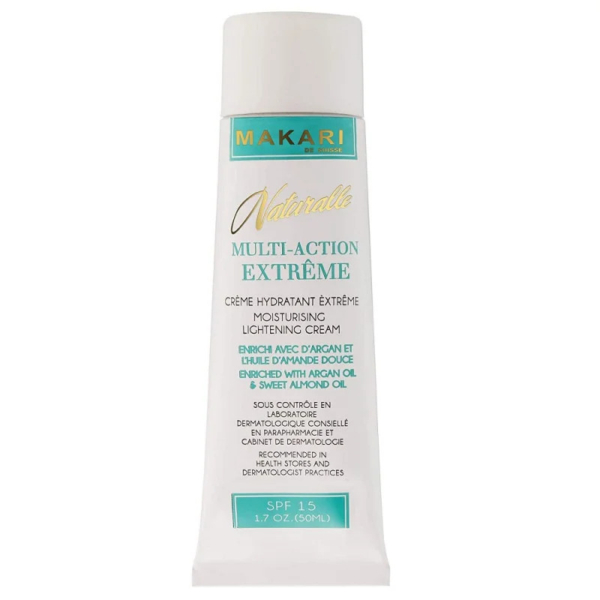 Un tube blanc portant l'inscription « Makari Naturalle Multi-Action Extrême » crème hydratante éclaircissante. Il contient de l'huile d'argan et d'amande douce, un FPS 15 et un format de 50 ml. L'emballage est principalement blanc avec des touches dorées et vertes. Dakar