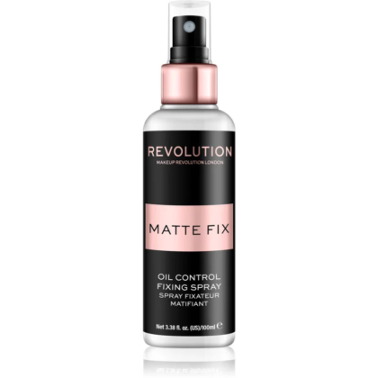 Un flacon de spray fixateur Revolution Matte Fix Oil Control, au design élégant et à l'étiquette noire et rose clair. Le spray est annoncé comme étant de 100 ml. Dakar