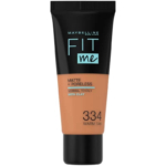 Tube de fond de teint Maybelline Fit Me Matte + Poreless, teinte 334 Warm Tan, conçu pour les peaux normales à grasses, à l'argile. L'emballage est noir sur le dessus et transparent sur le dessous pour laisser apparaître la couleur du fond de teint. Dakar