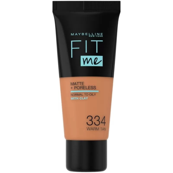 Tube de fond de teint Maybelline Fit Me Matte + Poreless, teinte 334 Warm Tan, conçu pour les peaux normales à grasses, à l'argile. L'emballage est noir sur le dessus et transparent sur le dessous pour laisser apparaître la couleur du fond de teint. Dakar