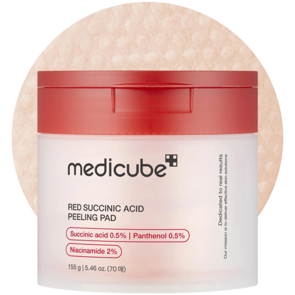 Un pot de disques exfoliants Medicube à l'acide succinique rouge avec un couvercle rouge. L'étiquette indique : acide succinique 0,5 %, panthénol 0,5 % et niacinamide 2 %. Le pot contient 70 disques et pèse 155 g. Dakar