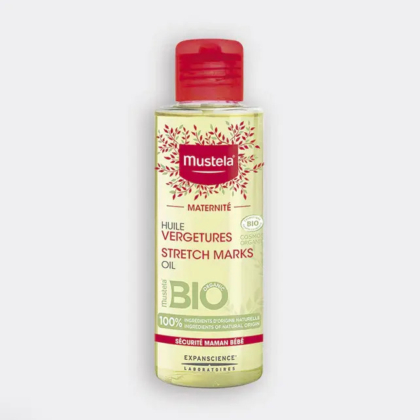 Un flacon d'Huile Vergetures Mustela avec un bouchon rouge. L'étiquette est jaune pâle avec un texte rouge et vert, ainsi qu'une certification bio et un motif de feuilles autour du nom de la marque. Convient aux femmes enceintes. Dakar