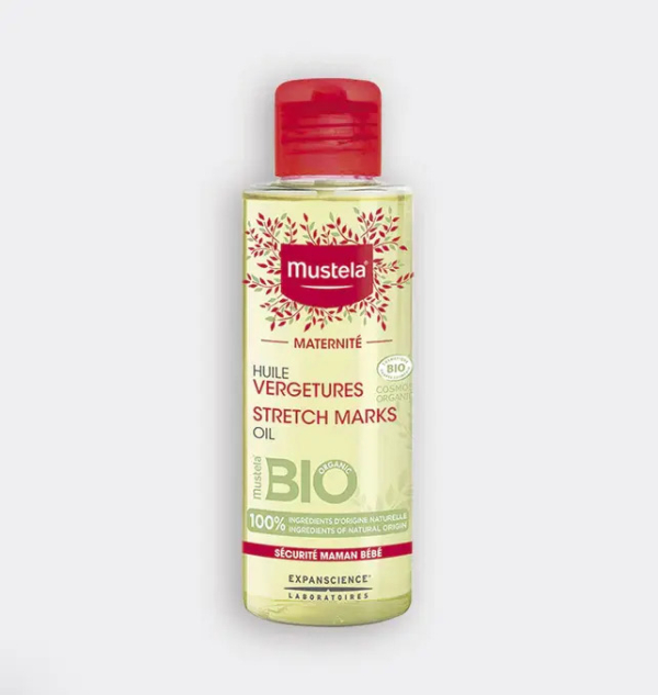 Un flacon d'Huile Vergetures Mustela avec un bouchon rouge. L'étiquette est jaune pâle avec un texte rouge et vert, ainsi qu'une certification bio et un motif de feuilles autour du nom de la marque. Convient aux femmes enceintes. Dakar
