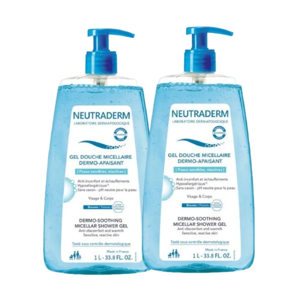 Deux flacons de Gel Douche Micellaire Dermo-Apaisant Neutraderm avec pompe bleue. Chaque flacon est étiqueté pour peaux sensibles, d'une contenance de 1 L (33,8 oz liq.), pour le visage et le corps. Dakar