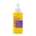 Un flacon jaune vif de sérum Nine Less B:Boost 1 % à l'acide kojique, avec une étiquette violette. Le flacon compte-gouttes est conçu pour cibler les taches brunes et la pigmentation, et contient des ingrédients comme la niacinamide, l'acide tranexamique et le glutathion. Dakar
