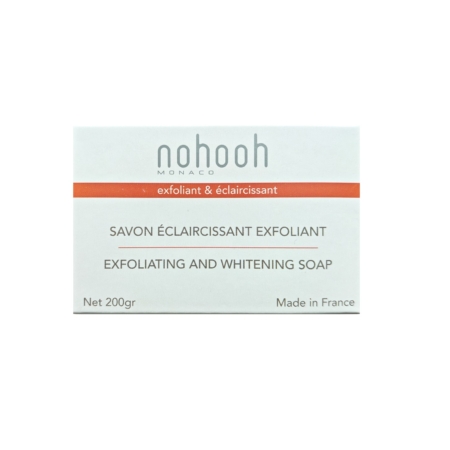 Un emballage de savon rectangulaire étiqueté « Nohooh Savon Éclaircissant Exfoliant Citronnelle 200 g » présente une bande orange avec les mots « exfoliant et éclaircissant ». Il est indiqué « SAVON EXFOLIANT ET BLANCHIMENT », « 200 g net » et « Fabriqué en France », comparable au Topicrem Mela Savon Pain pour sa qualité premium. Dakar