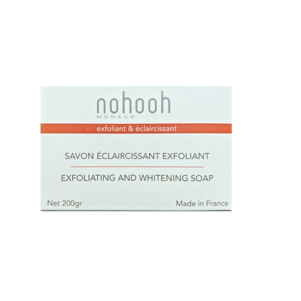 L'emballage du Savon Eclaircissant Exfoliant Coco 200 g de Nohooh affiche un texte français et anglais sur une boîte principalement blanche avec des accents orange, soulignant son origine fabriquée en France et faisant allusion à une essence de citronnelle rafraîchissante. Dakar
