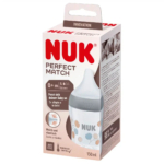Un biberon NUK est présenté dans une boîte. L'emballage met en valeur des caractéristiques telles que le contrôle de la température, la conception anti-colique et l'adaptation aux nouveau-nés (0 mois et plus). Le biberon est décoré de cercles colorés et contient 150 ml. Dakar
