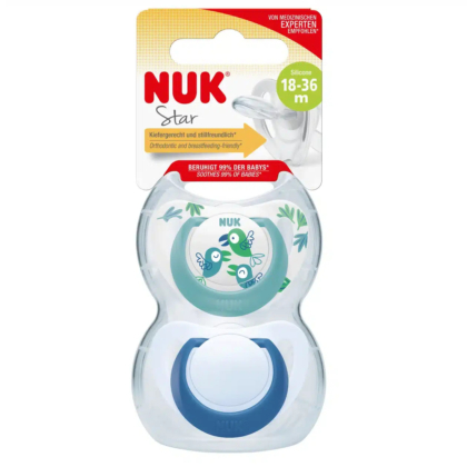 Emballage d'une sucette NUK Star pour les 18-36 mois, ornée d'un motif de grenouille. Ce produit est en silicone, orthodontique et adapté à l'allaitement. L'emballage indique la marque, les caractéristiques et l'âge du produit. Dakar