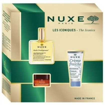 Coffret cadeau Nuxe Paris comprenant trois produits : l'Huile Prodigieuse, la Crème Fraîche et un petit pot de baume Nuxe. L'emballage est vert et or, orné d'un logo arbre et de l'inscription « Les Iconiques ». Fabriqué en France. Dakar