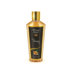 Un flacon d'huile de massage Plaisir Secret avec un bouchon doré et une étiquette noire. L'étiquette porte l'inscription « Huile de massage » et une image de fruits exotiques comme l'ananas et la papaye au fond. Dakar