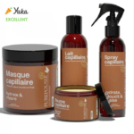 Une collection de quatre produits capillaires étiquetés en français : un grand pot de masque capillaire, un flacon de lait capillaire, un pot de baume capillaire et un vaporisateur. La marque PurePousse a reçu la note « Excellent » de Yuka. Dakar