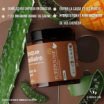 Un pot de masque capillaire étiqueté « PUREPOUSSE », entouré de feuilles d'aloe vera et d'une brosse en bois. Le texte souligne les bienfaits : démêlant, grand format de 500 ml, prévient la casse, hydrate et renforce. À partir de 1 ans. Dakar
