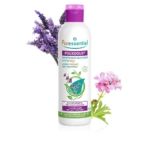 Un flacon de shampoing quotidien Puressentiel PouxDoux, orné de fleurs de lavande et de roses. L'étiquette indique qu'il est certifié bio et formulé avec des huiles essentielles. Dakar
