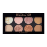 Une palette de maquillage composée de huit godets circulaires proposant différentes nuances de blush et d'enlumineur. Présentée dans un packaging noir avec l'inscription « Revolution » imprimée en doré sur le dessus. Dakar