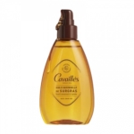 Flacon transparent d'Huile Universelle de Surgras Cavaillès, avec un liquide ambré et une pompe marron foncé. L'étiquette indique qu'elle nourrit, hydrate intensément et régénère la peau. Dakar