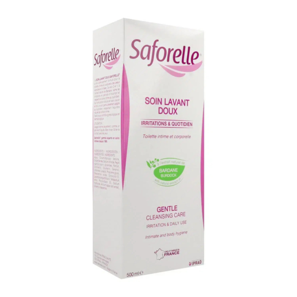 Boîte blanche et rose de Saforelle Soin Lavant Doux pour l'hygiène intime et corporelle. L'emballage est imprimé en français et en anglais, soulignant son utilisation quotidienne et son action irritante. Contient de la bardane. Fabriqué en France, 500 ml. Dakar