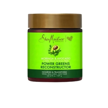 Un pot de soin reconstructeur Shea Moisture Power Greens pour cheveux fragilisés, ternes, bouclés et crépus. L'emballage arbore un design vert et doré mettant en valeur les ingrédients à base de moringa et d'avocat. Poids net : 227 g. Dakar