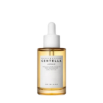 Un flacon transparent avec un bouchon compte-gouttes étiqueté « Ampoule Centella de Madagascar » de Skin1004. Le flacon contient un liquide doré et est isolé sur un fond blanc. Dakar