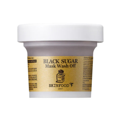 Un pot de masque nettoyant au sucre noir Skinfood. L'emballage est blanc avec une étiquette dorée indiquant le nom du produit et le logo de la marque. Dakar